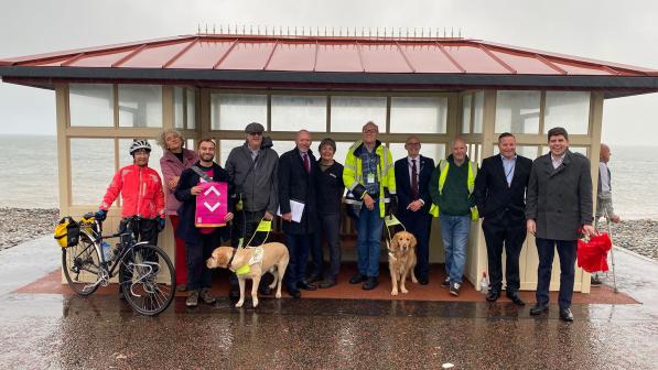 Tomos Owens_Walk and talk huddled in a shelter_Welsh Labour conference_2024_01.JPG