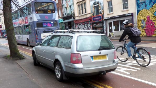 A car is parked in a mandatory cycle lane. Photo by Sam Saunders