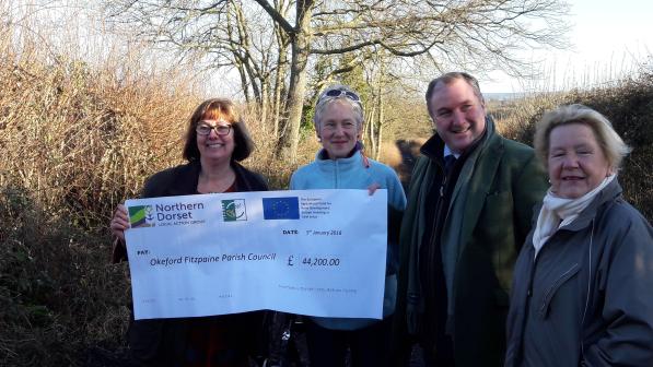 Cheque being handed over to fund the work on Little Lane