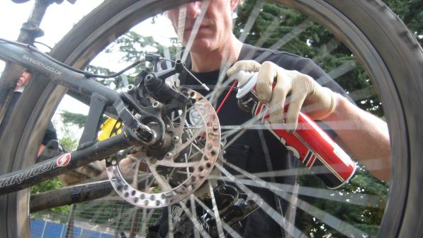 Life Cycle mechanic working on a bike