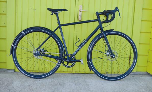 Genesis Day One 10, a singlespeed bike with mudguards, drop bar and bottle cage