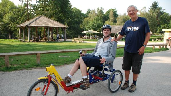Recumbent rider with volunteer