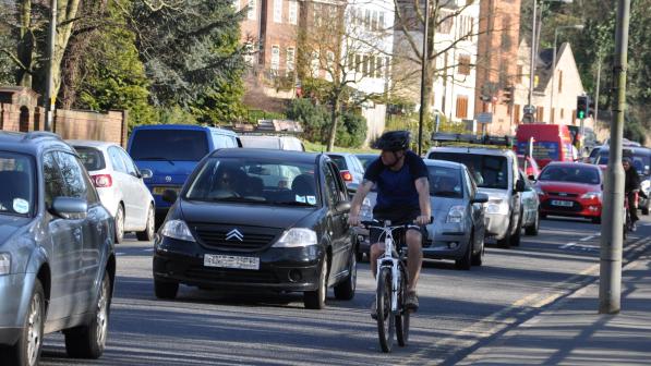 Cyclist riding on road