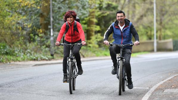 Two cyclists riding on-road