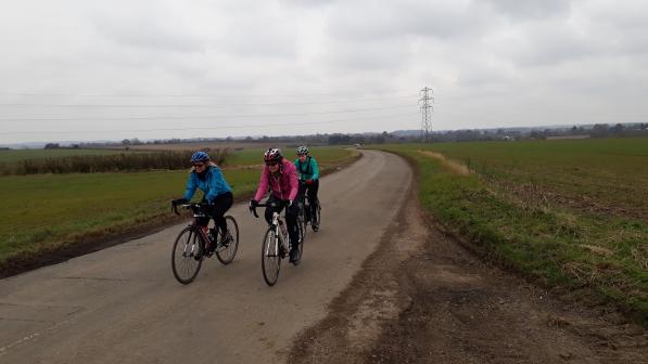 Three riders on a country lane