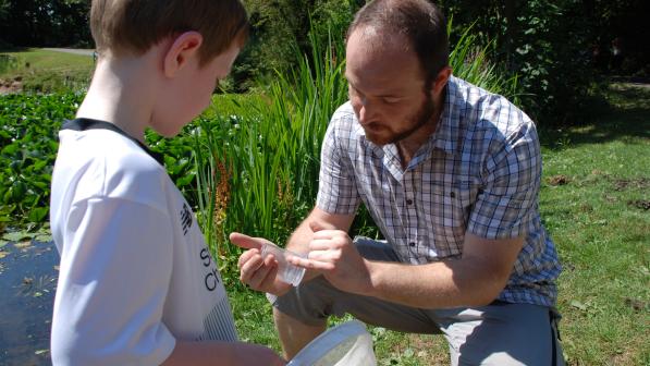 Wildlife expert Ben Deed telling Cillian McIlroy all about the local pond life 