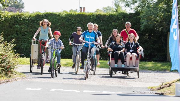 Participants riding a variety of bikes and trikes at the WheelNess project launch in Inverness