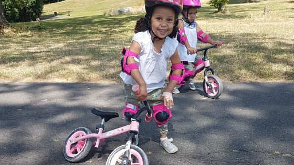 Christina's twin daughters, Esmee and Desiree, on their balance bikes