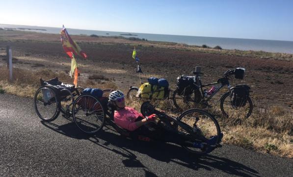 Karen Darke on her handcycle alongside the Murray River