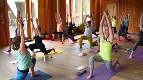 Cyclists practising yoga 