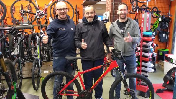 Steven collects the 100th bike provided by WheelNess