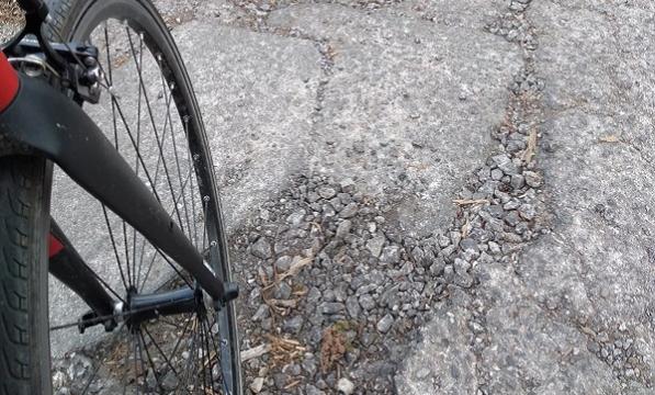 Cycle wheel in pothole