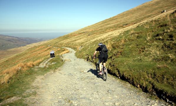 Mountain biker riding down Llanberis Path on Snowdon