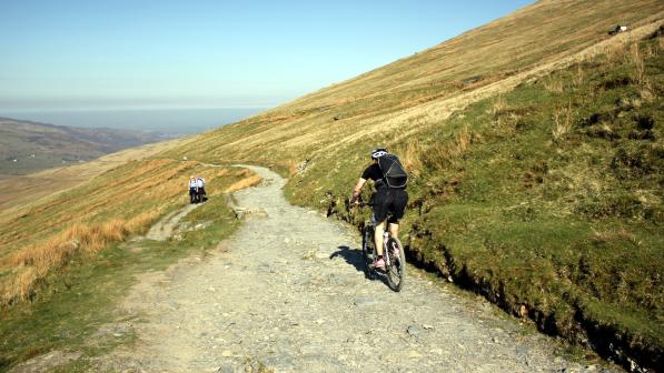 Mountain biker riding down Llanberis Path on Snowdon