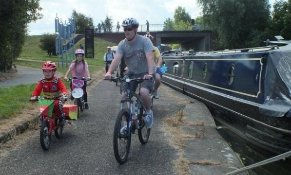 Family riding canalside
