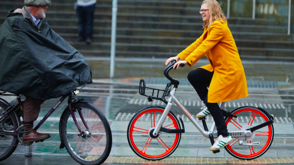 Helen Pidd riding a Mobike in the rain