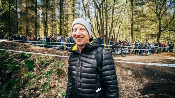 Henry in front of a mountain bike competition