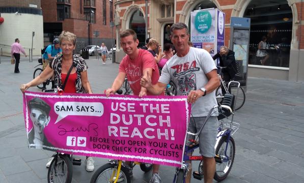 A critical mass memorial ride for Sam Boulton promoted the use of the Dutch Reach