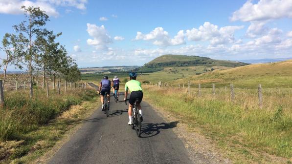 Three riders on a descent in the Lakes