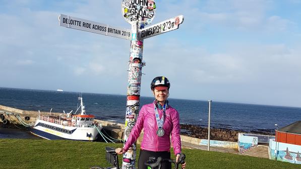 Laura Laker with her bike at John o' Groats