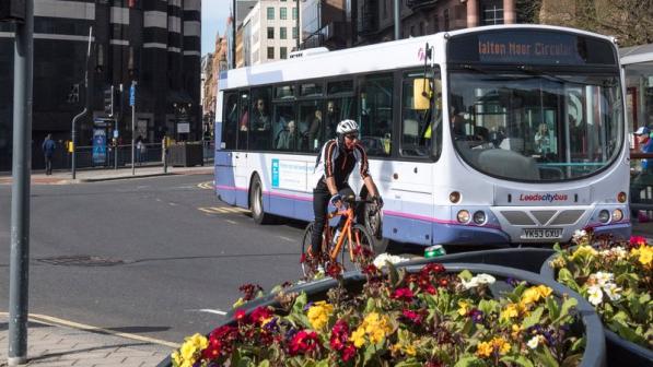 Cyclist and bus