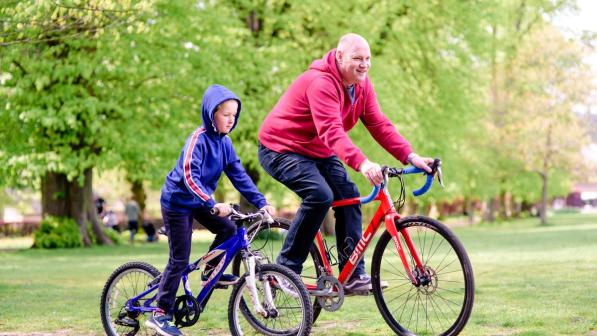 Father and son cycling together. Photo by Julie Skelton