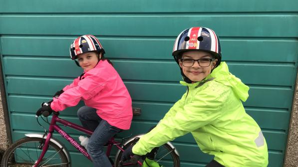 Children in waterproof cycle jackets 