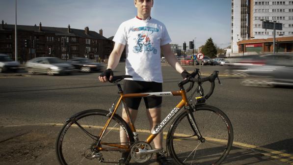David Brennan standing with his bicycle