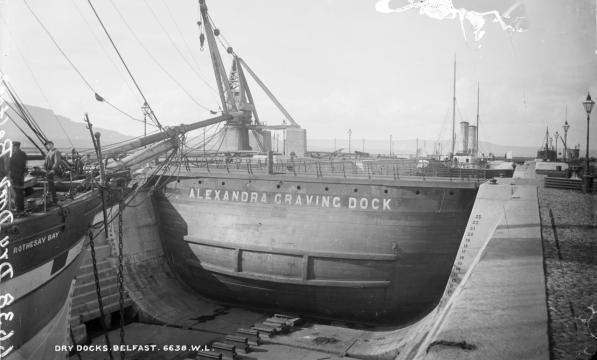 An old black and white postcard of the dry docks in Belfast