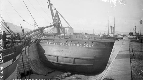 An old black and white postcard of the dry docks in Belfast