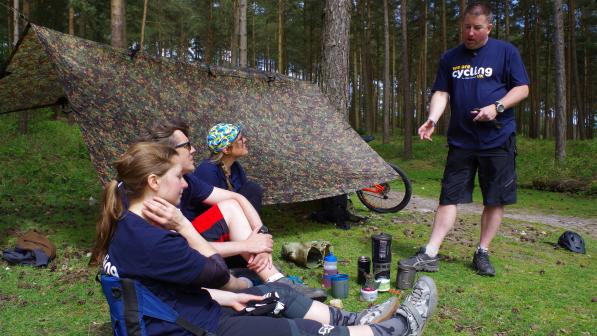 A course leader carrying out some training in the forest