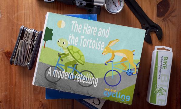 The Hare and the tortoise book among some cycling stools