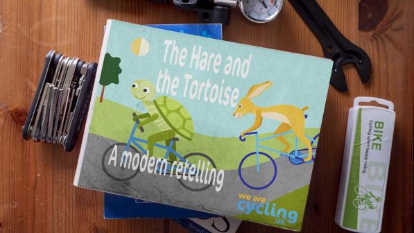 The Hare and the tortoise book among some cycling stools