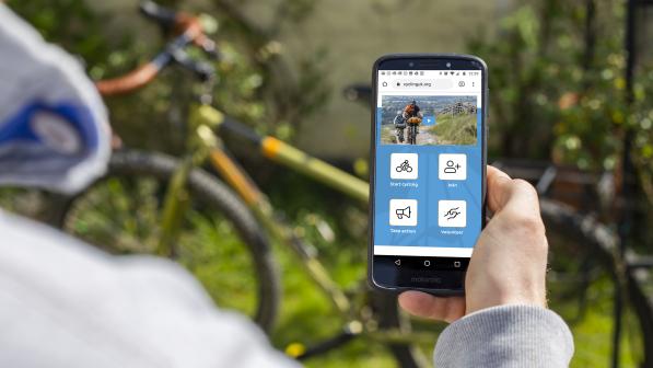 Anonymous person looking at Cycling UK website on smartphone