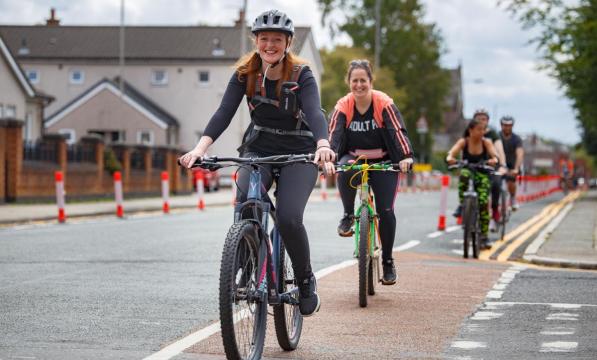 women cycling in urban area