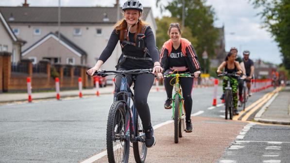 women cycling in urban area