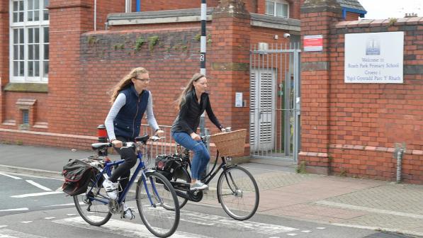 Two cyclists riding abreast