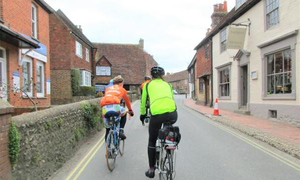 Riding up the main street in Alfriston