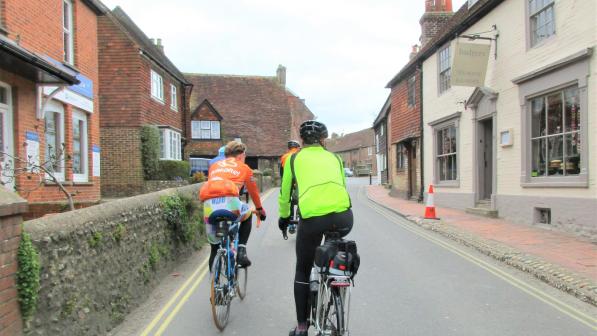Riding up the main street in Alfriston