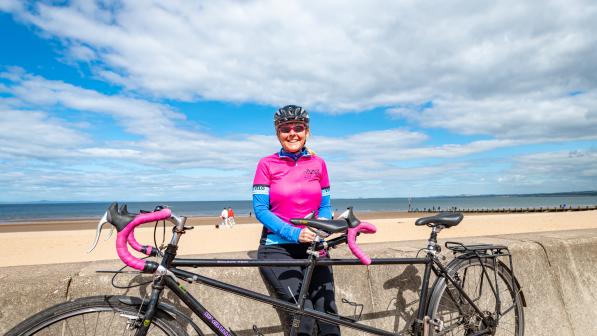 woman with tandem at seafront