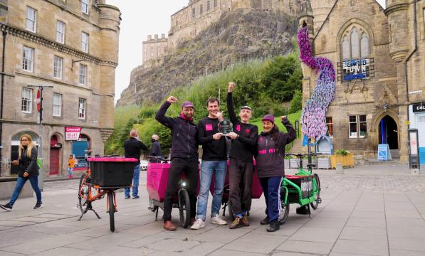 Employees of Farr Out Deliveries holding their award in Edinburgh