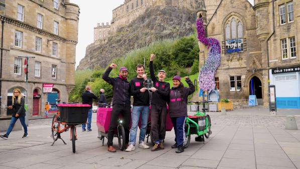Employees of Farr Out Deliveries holding their award in Edinburgh