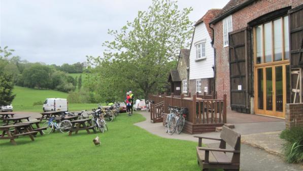 Cycles and two riders outside Heaven Farm