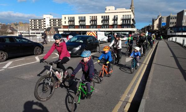 Kidical Mass ride through Inverness in March 2022