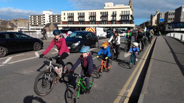 Kidical Mass ride through Inverness in March 2022