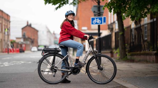 Cyclist on an e-cycle in Manchester for Cycling made e-asy