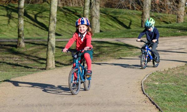 Two children on a cycle path in Surrey