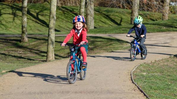 Two children on a cycle path in Surrey