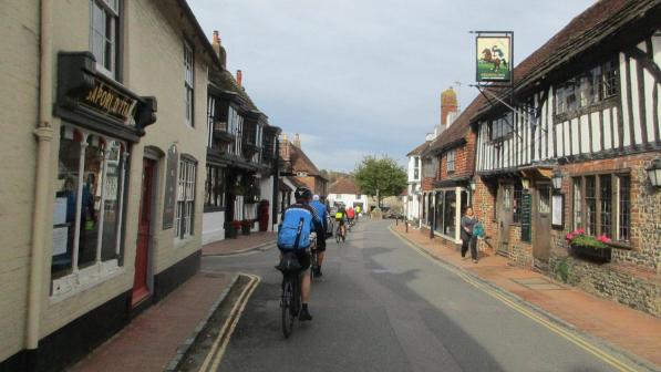 People cycling into Alfriston village