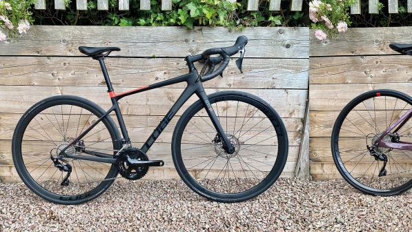 A composite image of two road bikes, on the left is a black Cube bike on the right is a purple Decathlon bike